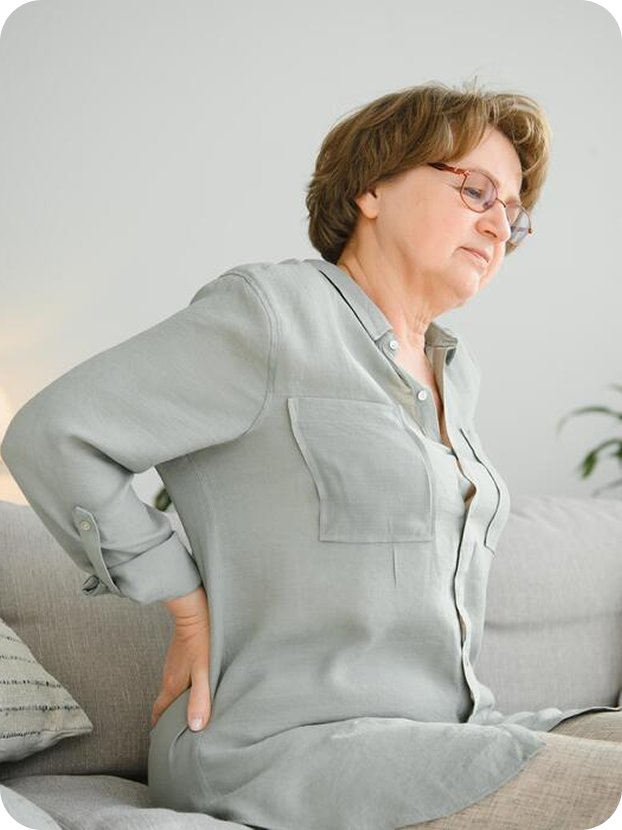 Woman holding her lower back in pain