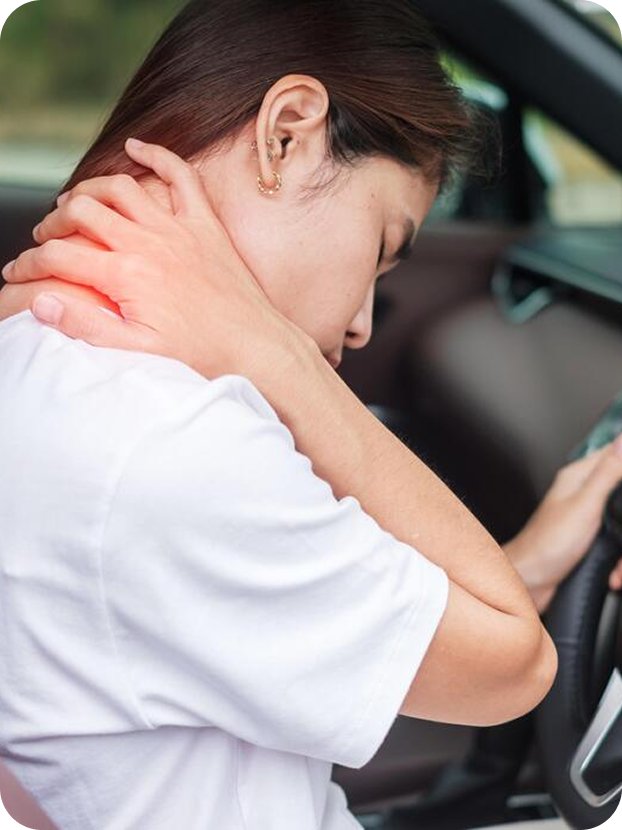 Driver holding her neck after a rear-end collision